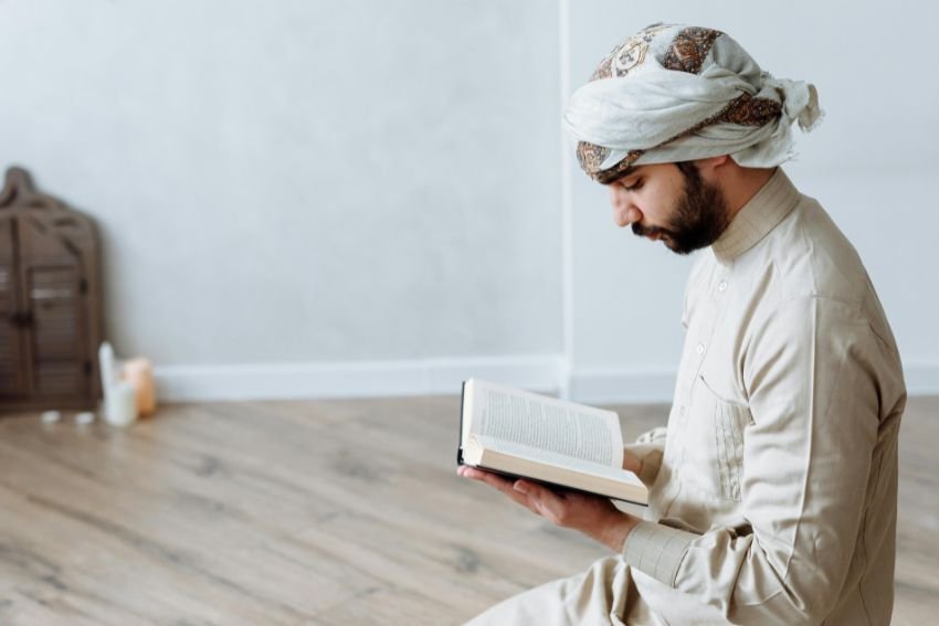 man reciting quran